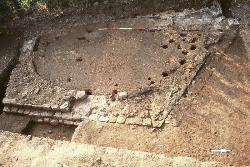 Plate 2. The apsidal wing, note the floor laid over the north (right) wall, the new foundation on right side (north), and the stakeholes, centre, inserted into already robbed walling.